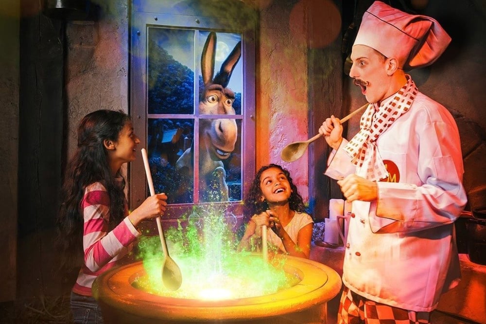 Shreks Adventure London and Two Course Meal and Drink for Three